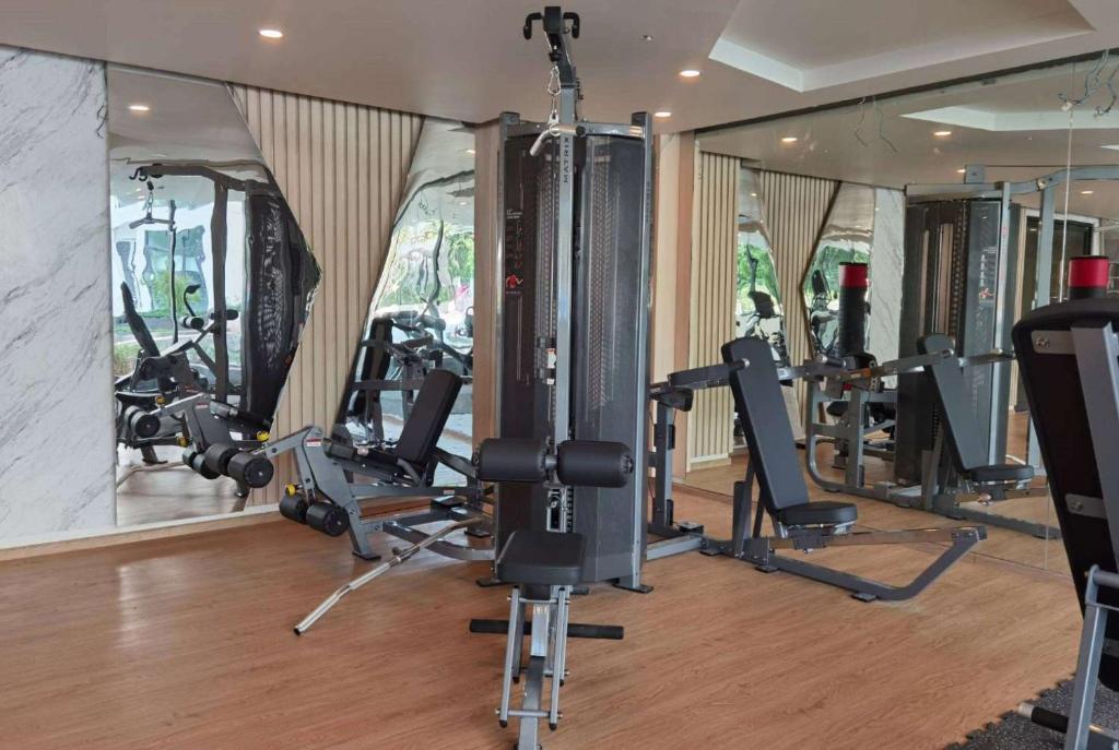 a gym with several tread machines in a room at Wyndham La Vita Rawai Phuket in Rawai Beach