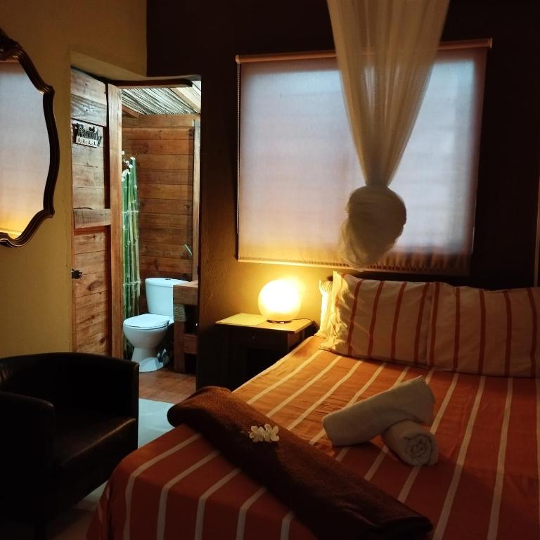 Postel nebo postele na pokoji v ubytování ECOVILLA CORAL GARDEN
