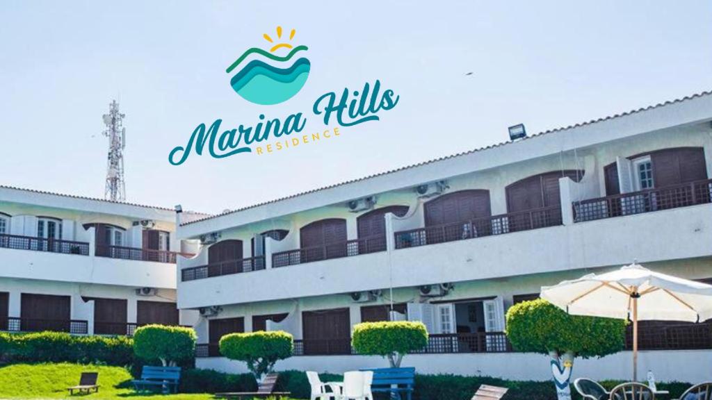 a hotel with a sign that reads miami hills at Marina Hills Residence in El Alamein