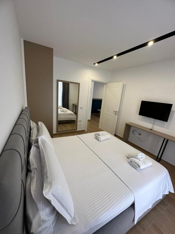 Postel nebo postele na pokoji v ubytování Suite Hotel
