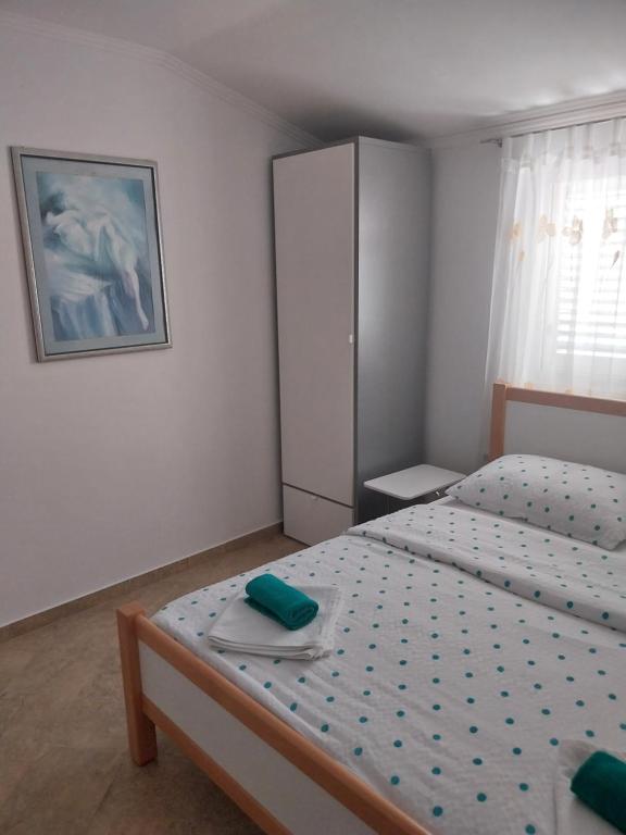 Postel nebo postele na pokoji v ubytování Apartments Leon