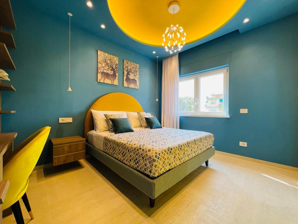 Postel nebo postele na pokoji v ubytování YourHome - Lucrezia Suites