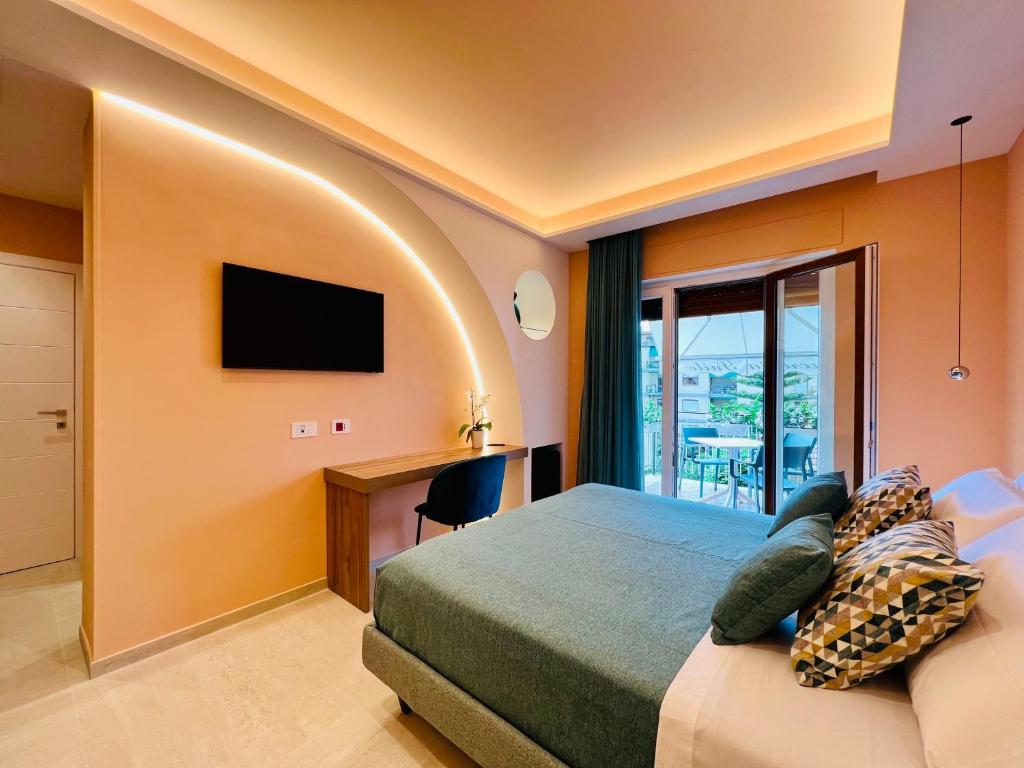 Postel nebo postele na pokoji v ubytování YourHome - Lucrezia Suites