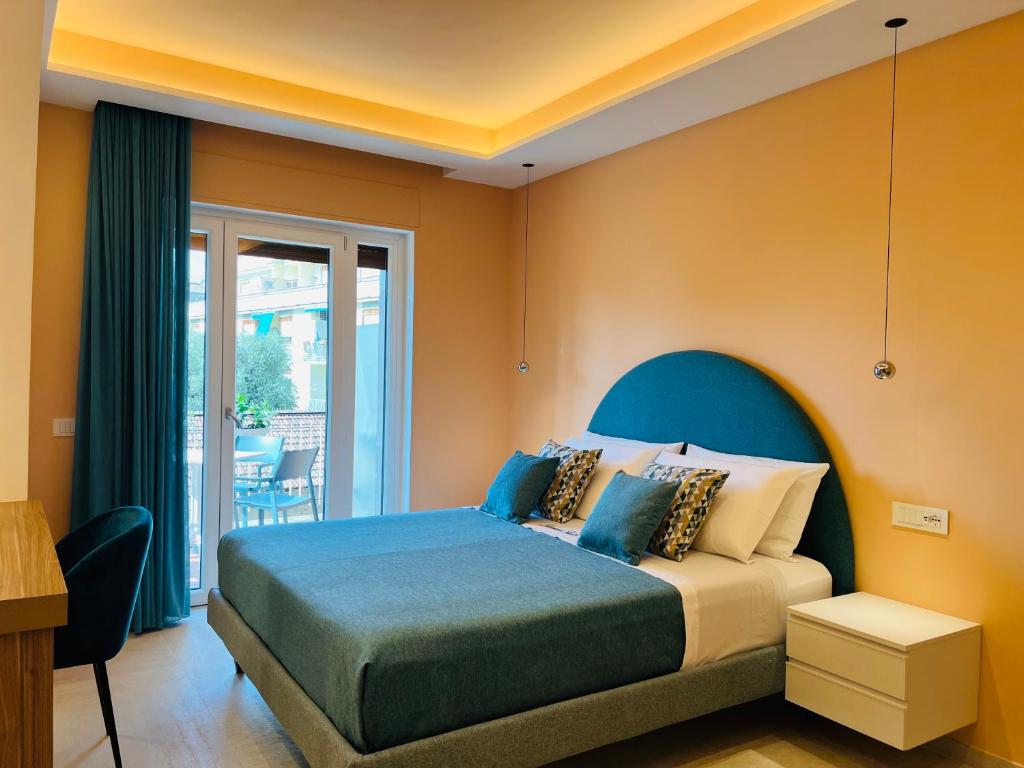 Postel nebo postele na pokoji v ubytování YourHome - Lucrezia Suites