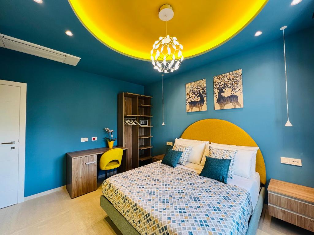 Postel nebo postele na pokoji v ubytování YourHome - Lucrezia Suites