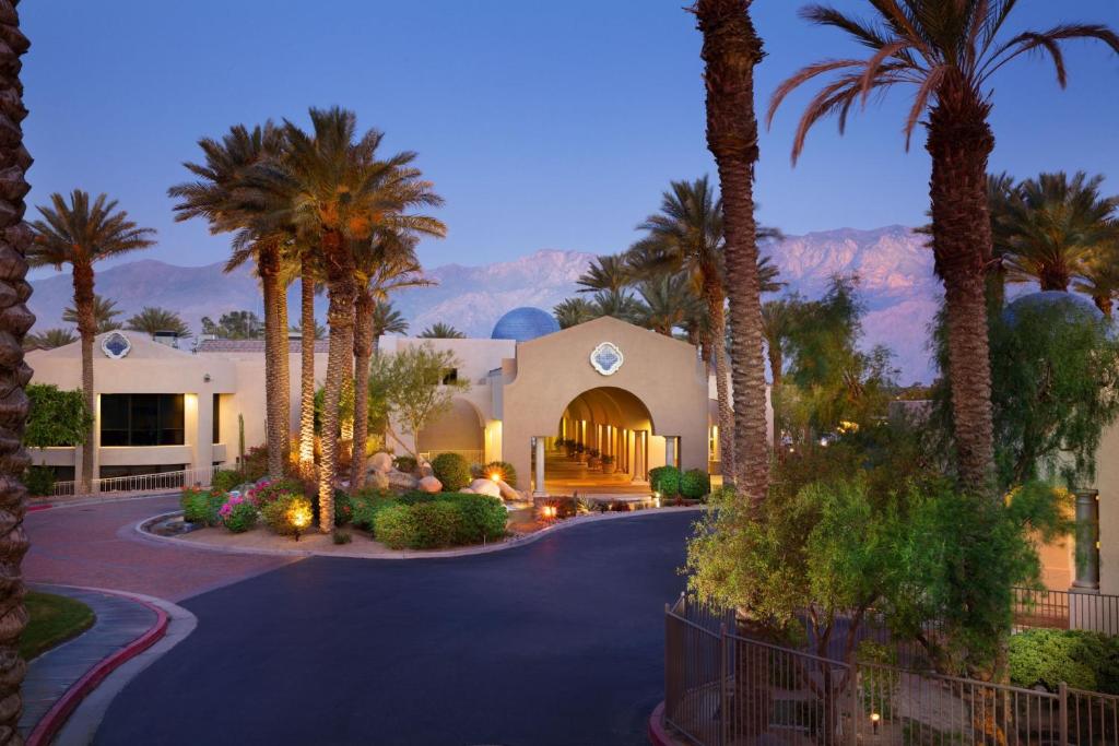 a home with palm trees and a driveway at The Westin Mission Hills Resort Villas, Palm Springs in Rancho Mirage