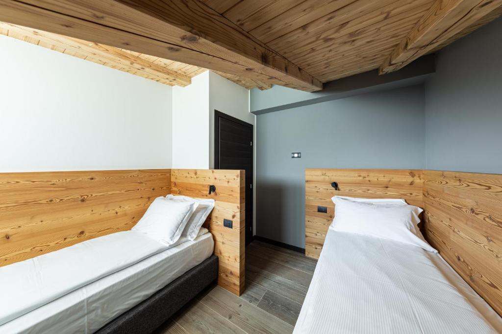 Postel nebo postele na pokoji v ubytování Belsit Apartments