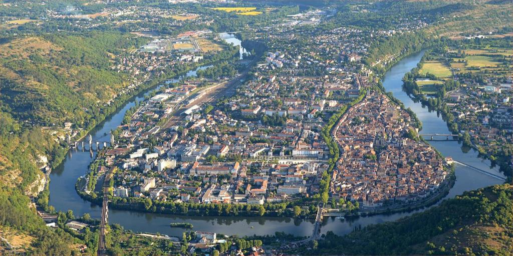 an aerial view of a town next to a river at Gambetta 304 CahorsCityStay in Cahors