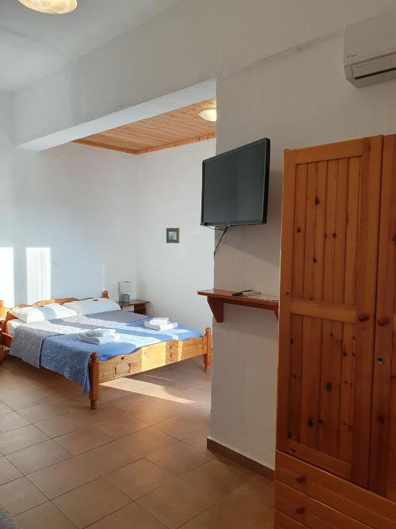 Postel nebo postele na pokoji v ubytování Babis & Popi Rooms and Studios