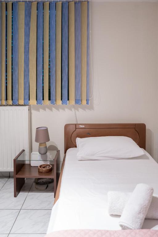Postel nebo postele na pokoji v ubytování A&S Seaside Maisonette