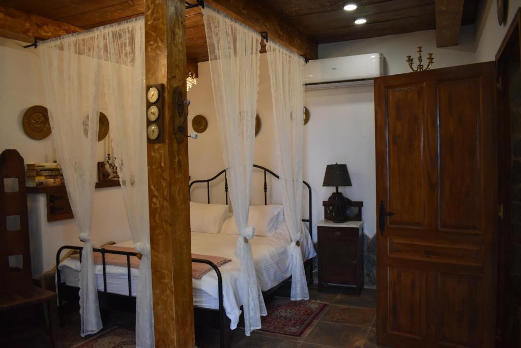 Postel nebo postele na pokoji v ubytování ROMANTICA
