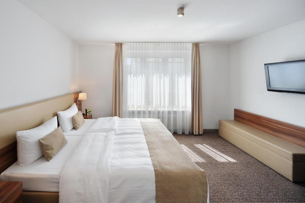 Postel nebo postele na pokoji v ubytování Downtown Vi Vadi Hotel