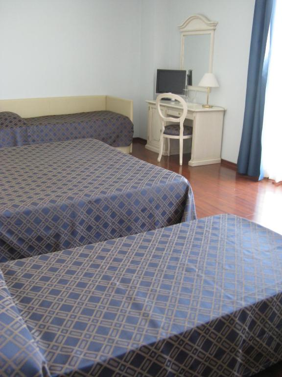 International Hotel - Habitación Cuádruple