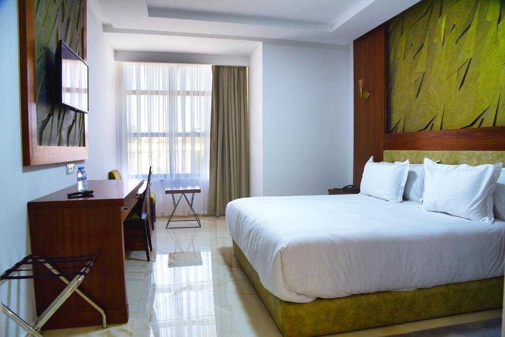 Ένα ή περισσότερα κρεβάτια σε δωμάτιο στο MIRANDA HOTEL - Tanger