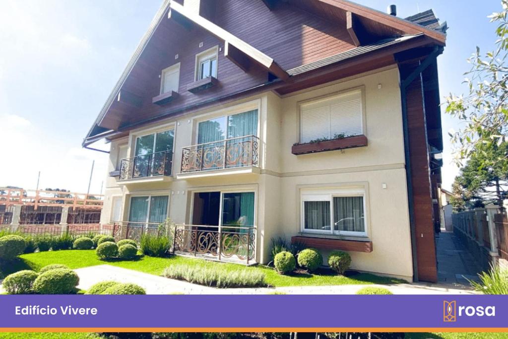a house with a balcony on the side of it at Rosa Edifício Vivere Canela in Canela