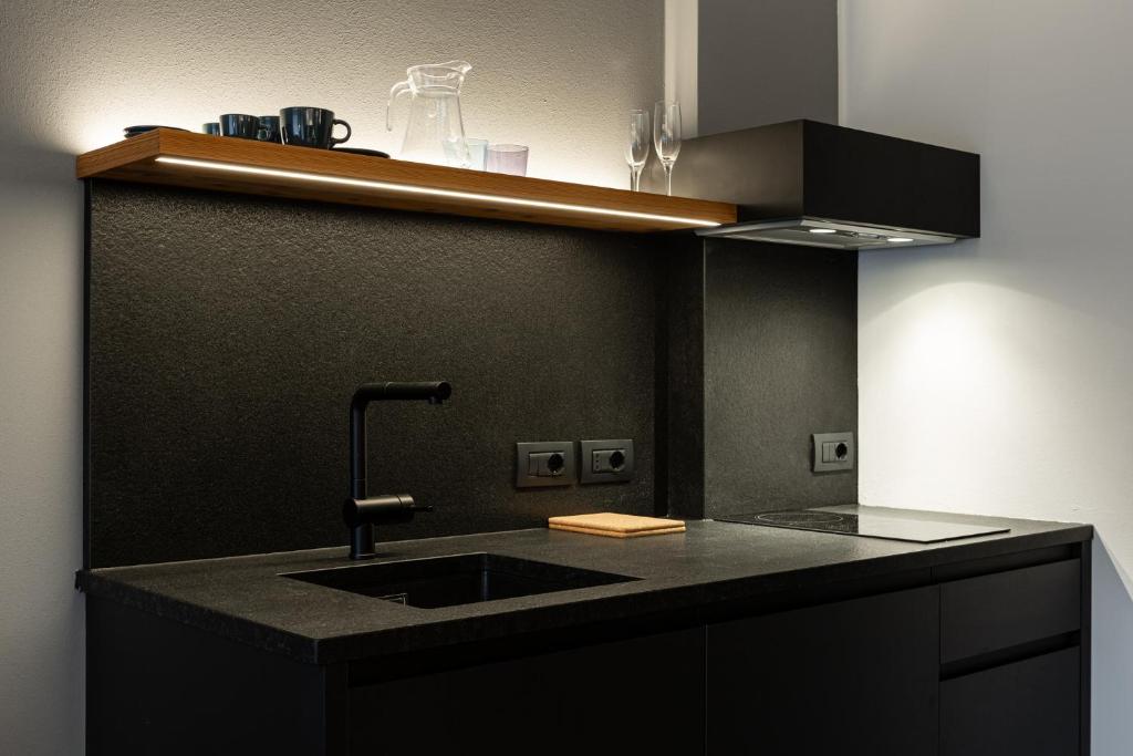 Kuchyň nebo kuchyňský kout v ubytování Belsit Apartments