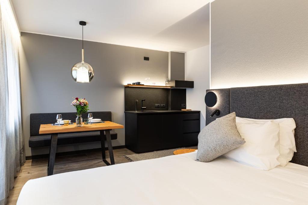 Postel nebo postele na pokoji v ubytování Belsit Apartments