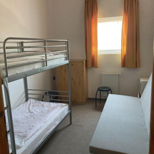 Postel nebo postele na pokoji v ubytování Pizza Sztori Apartman