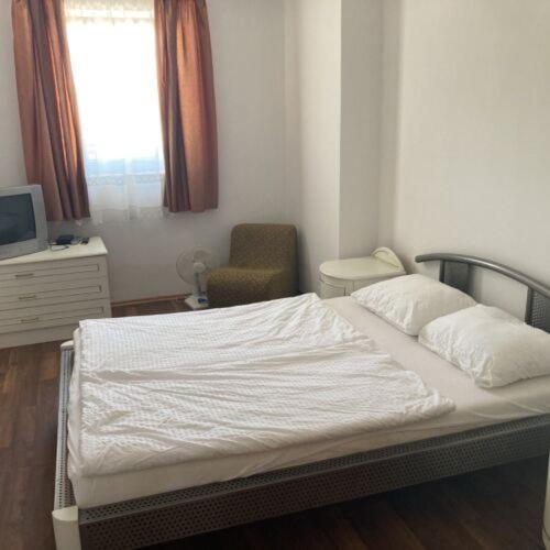 Postel nebo postele na pokoji v ubytování Pizza Sztori Apartman