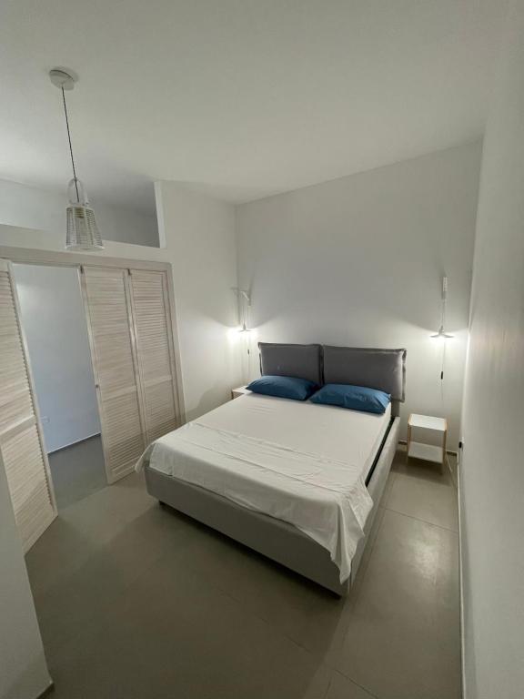 Postel nebo postele na pokoji v ubytování Blue Apartment