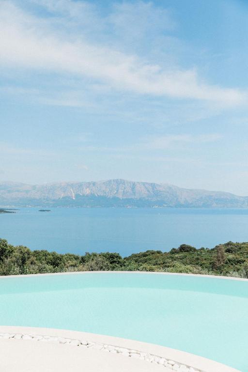 a view of the blue lagoon from a beach at Tempestini Exclusive Villas in Nikiana