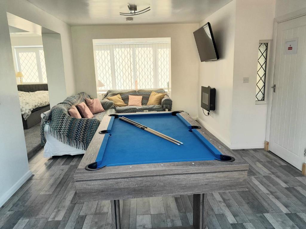 a living room with a pool table in the middle of it at One bed stunning apartment with parking right outside, close to Burton town centre in Burton upon Trent