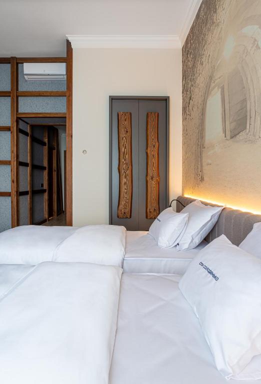 Postel nebo postele na pokoji v ubytování Villa Boutique Hotel