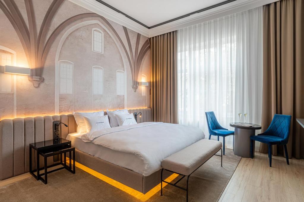 Postel nebo postele na pokoji v ubytování Villa Boutique Hotel