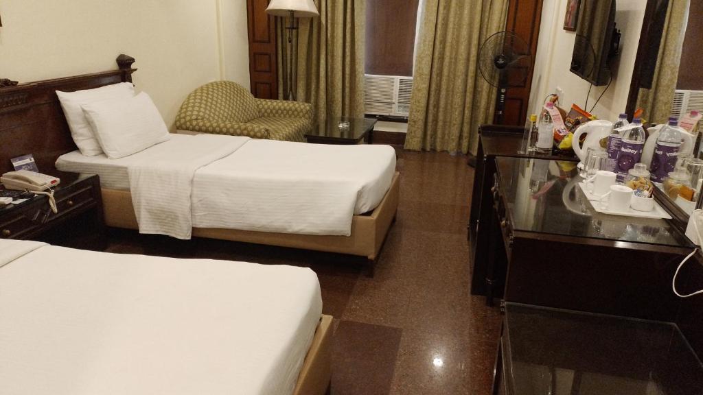 Postel nebo postele na pokoji v ubytování Hotel Empires
