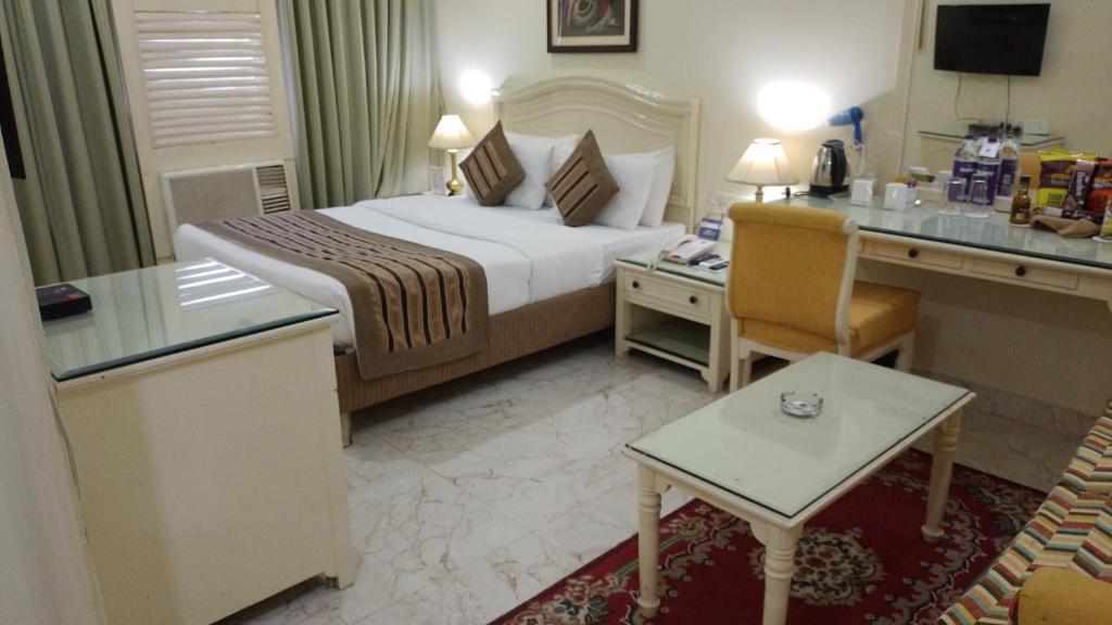 Postel nebo postele na pokoji v ubytování Hotel Empires