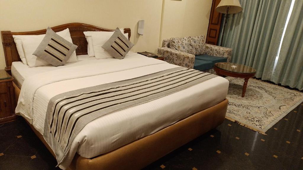Postel nebo postele na pokoji v ubytování Hotel Empires