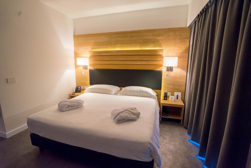 Posteľ alebo postele v izbe v ubytovaní PM Hotel