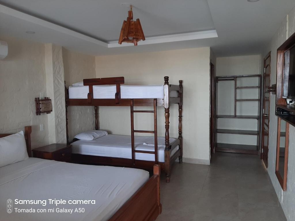 Postel nebo postele na pokoji v ubytování Hotel La Vista