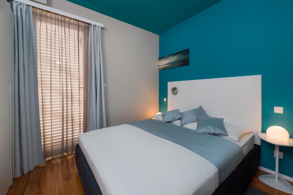Postel nebo postele na pokoji v ubytování Apartments Villa Azzurra Bol