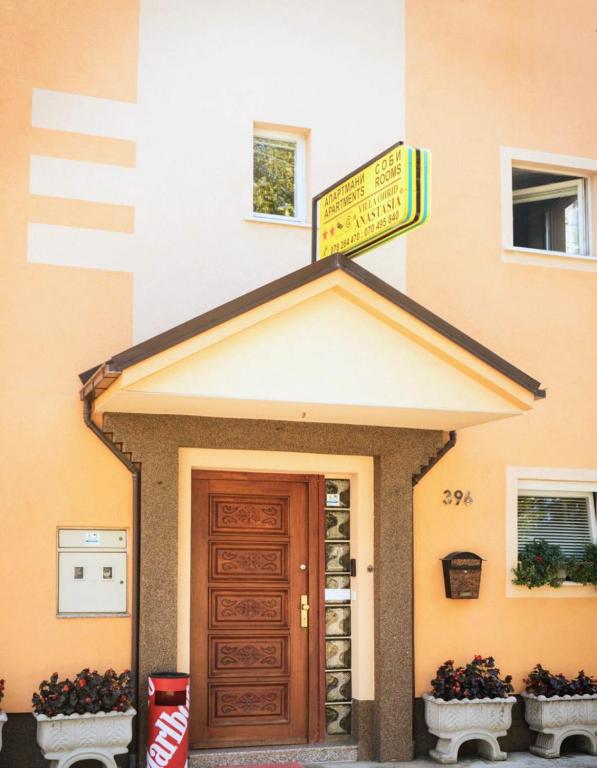 a sign on the front of a building with a door at Villa Ohrid Anastasia in Ohrid
