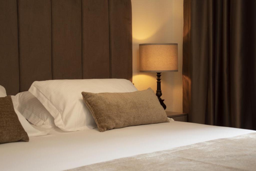 Postel nebo postele na pokoji v ubytování VillaMara Luxury rooms