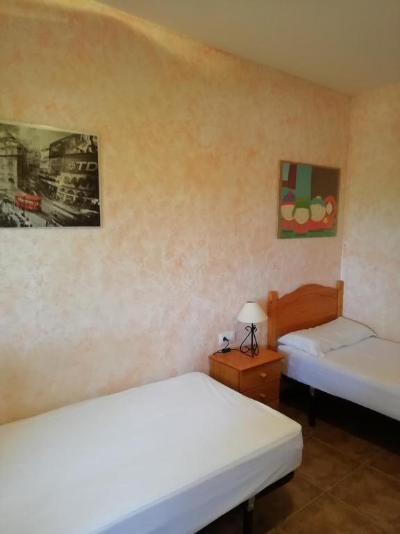 Postel nebo postele na pokoji v ubytování Mari & Jose Ramon Casa 10 personas - 7 adultos max
