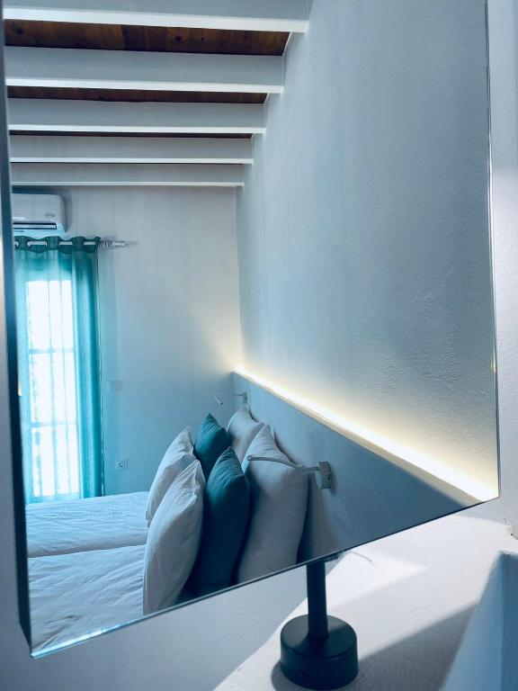 Postel nebo postele na pokoji v ubytování Arhontiko Houses