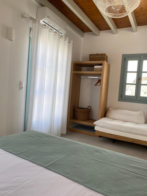 Postel nebo postele na pokoji v ubytování Arhontiko Houses
