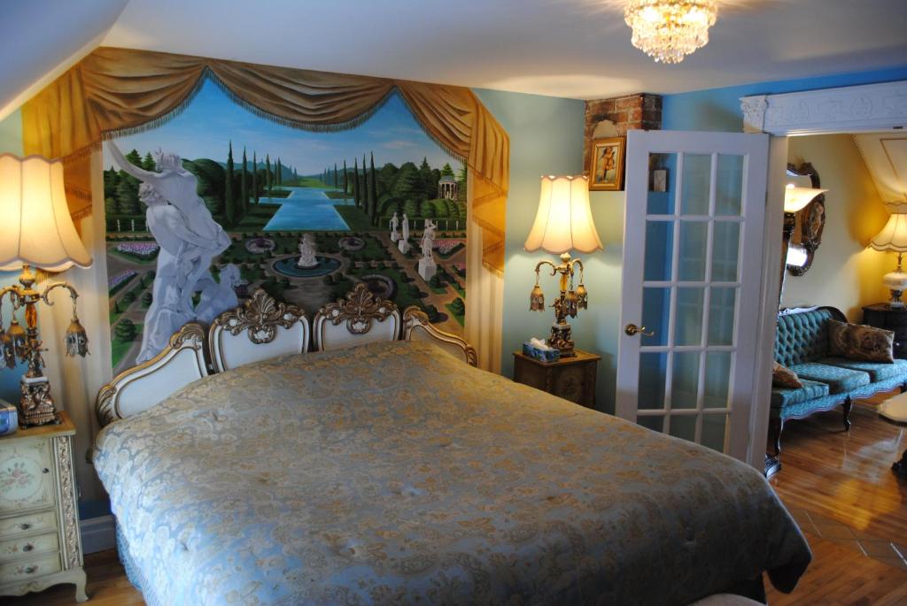 Postel nebo postele na pokoji v ubytování Auberge Marquis de Montcalm