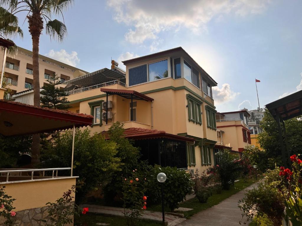 a house with a large window on top of it at ViLLA CLUB KONAK 10 in Alanya