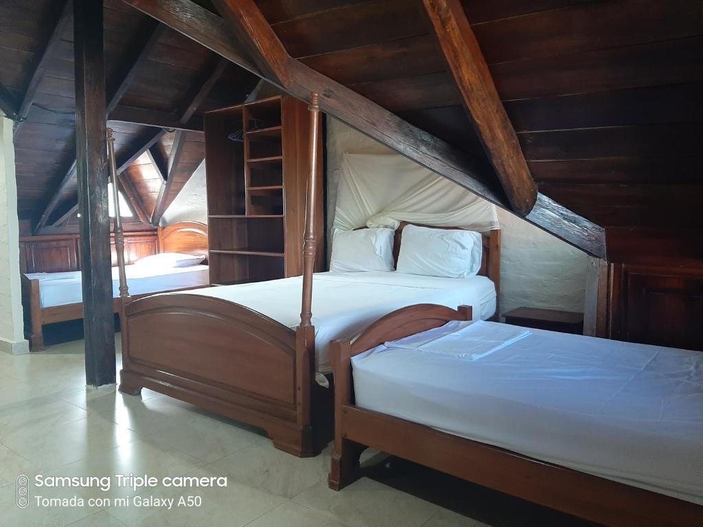 Postel nebo postele na pokoji v ubytování Hotel La Vista