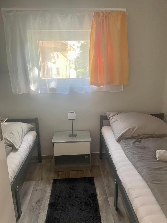 Posteľ alebo postele v izbe v ubytovaní Gombi nyaraló