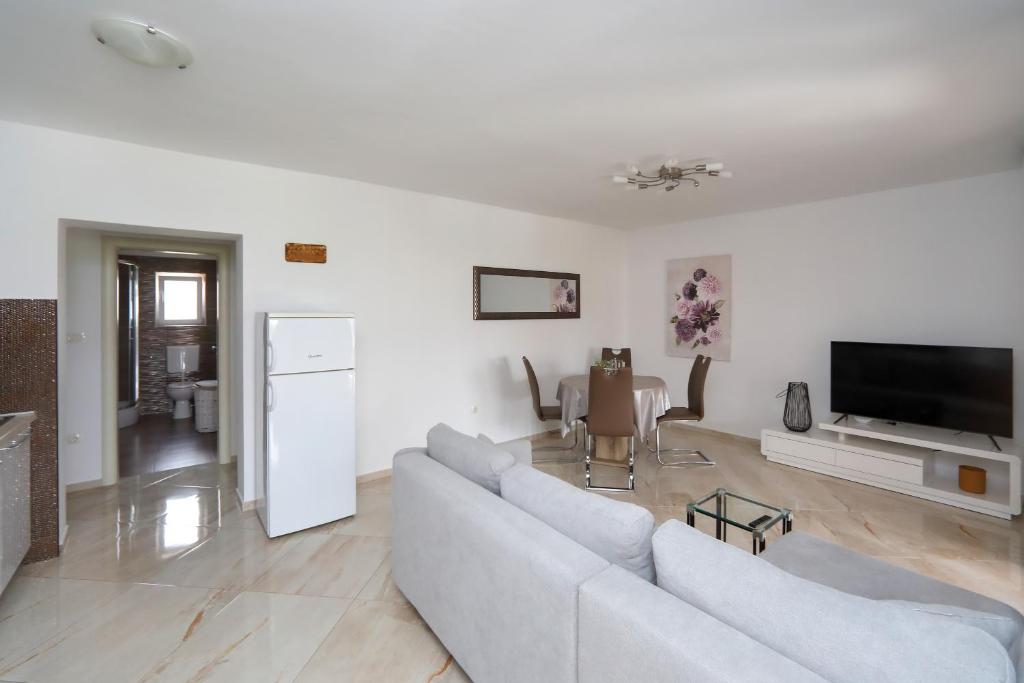 TV a/nebo společenská místnost v ubytování Apartment Alfonso