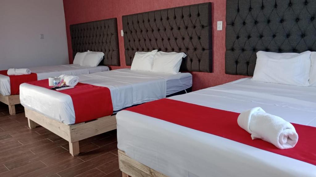 Postel nebo postele na pokoji v ubytování Hotel La Intimidad