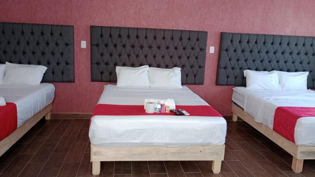 Postel nebo postele na pokoji v ubytování Hotel La Intimidad