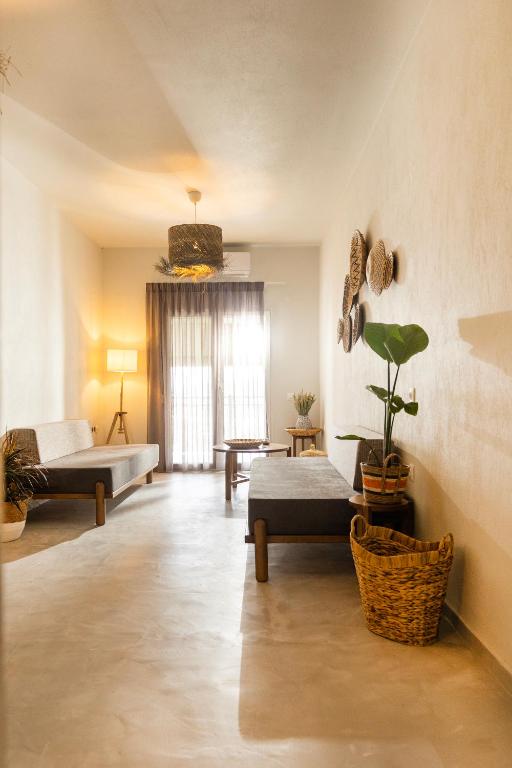 Postel nebo postele na pokoji v ubytování Dohos Skiathos Suites