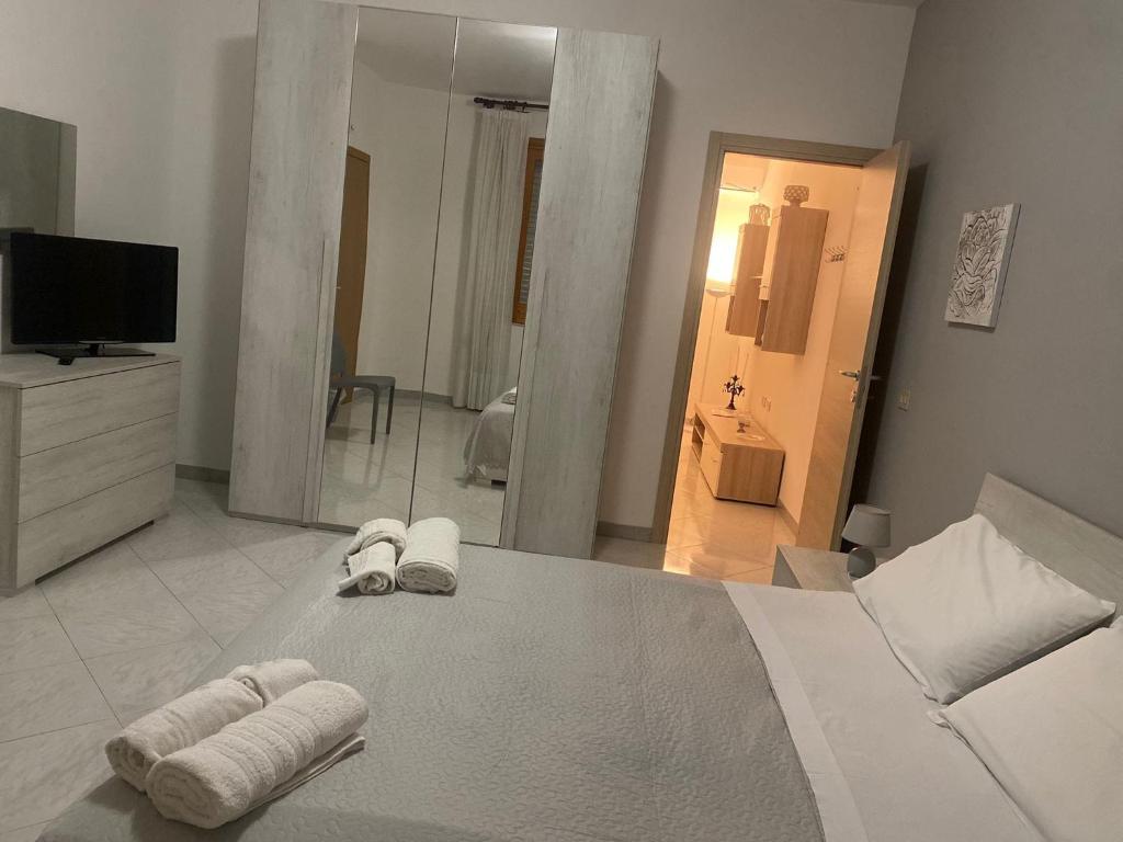 Ένα ή περισσότερα κρεβάτια σε δωμάτιο στο Montalbano House - Casa Vacanze