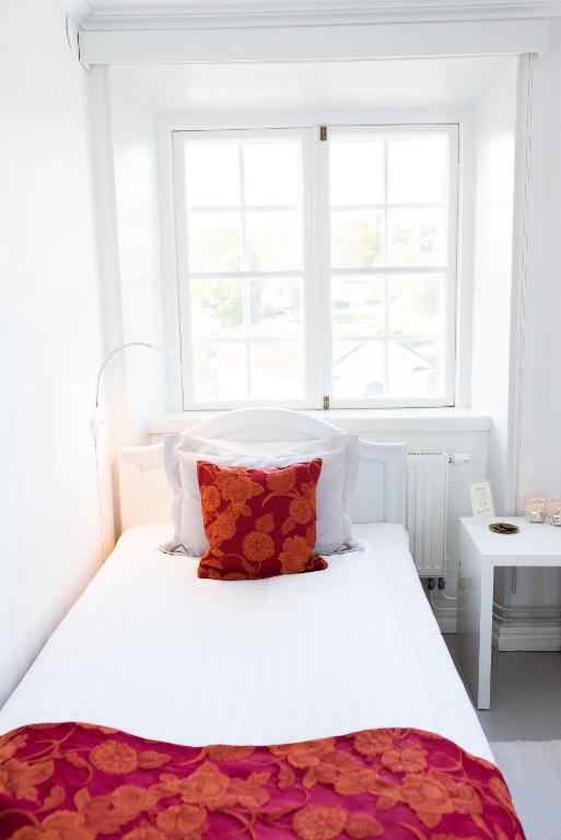 Postel nebo postele na pokoji v ubytování Mauritzbergs Slott & Golf