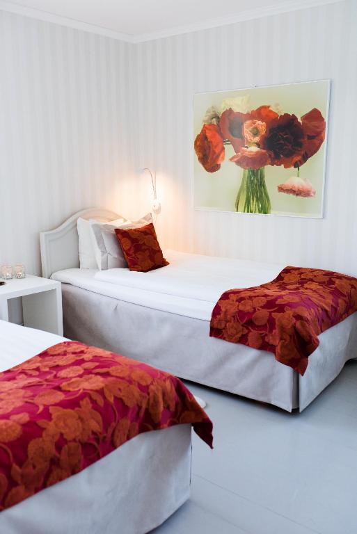Postel nebo postele na pokoji v ubytování Mauritzbergs Slott & Golf